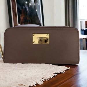 Michael Kors Continental zippered around wallet light purple gold interior